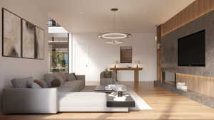 Spacious living area featuring light wood-finish flooring, a contemporary linear fireplace, and a striking media wall with integrated shelving