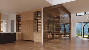 Expansive open-concept interior featuring light wood-finish flooring and a full-height wood-paneled wall