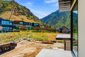 Modern mountain architecture with expansive glass panels and a flat roofline