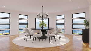 Spacious dining area featuring a black chandelier, recessed lighting, and herringbone wood-finish flooring