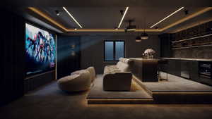 Dedicated home theater featuring a large projection screen, recessed linear lighting, and a raised seating platform