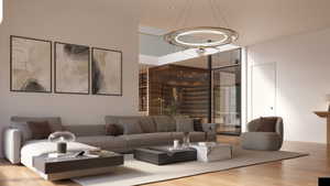 Spacious living area featuring light wood-finish flooring and a contemporary overhead light fixture