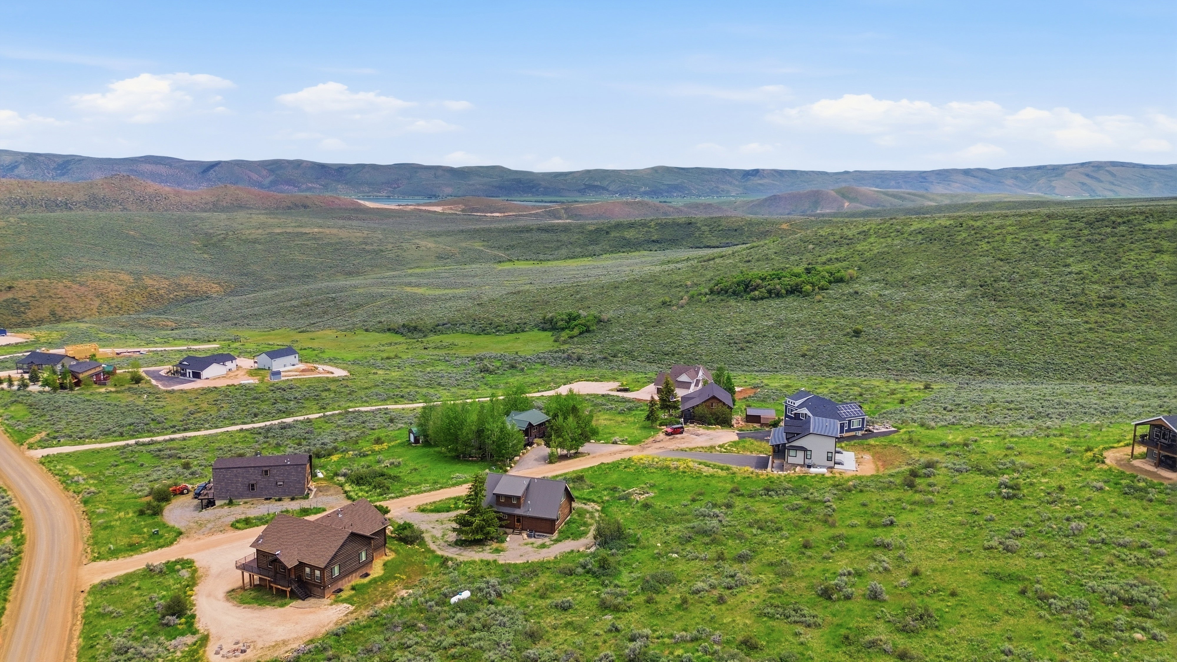 Expansive open land with rolling hills and distant mountains