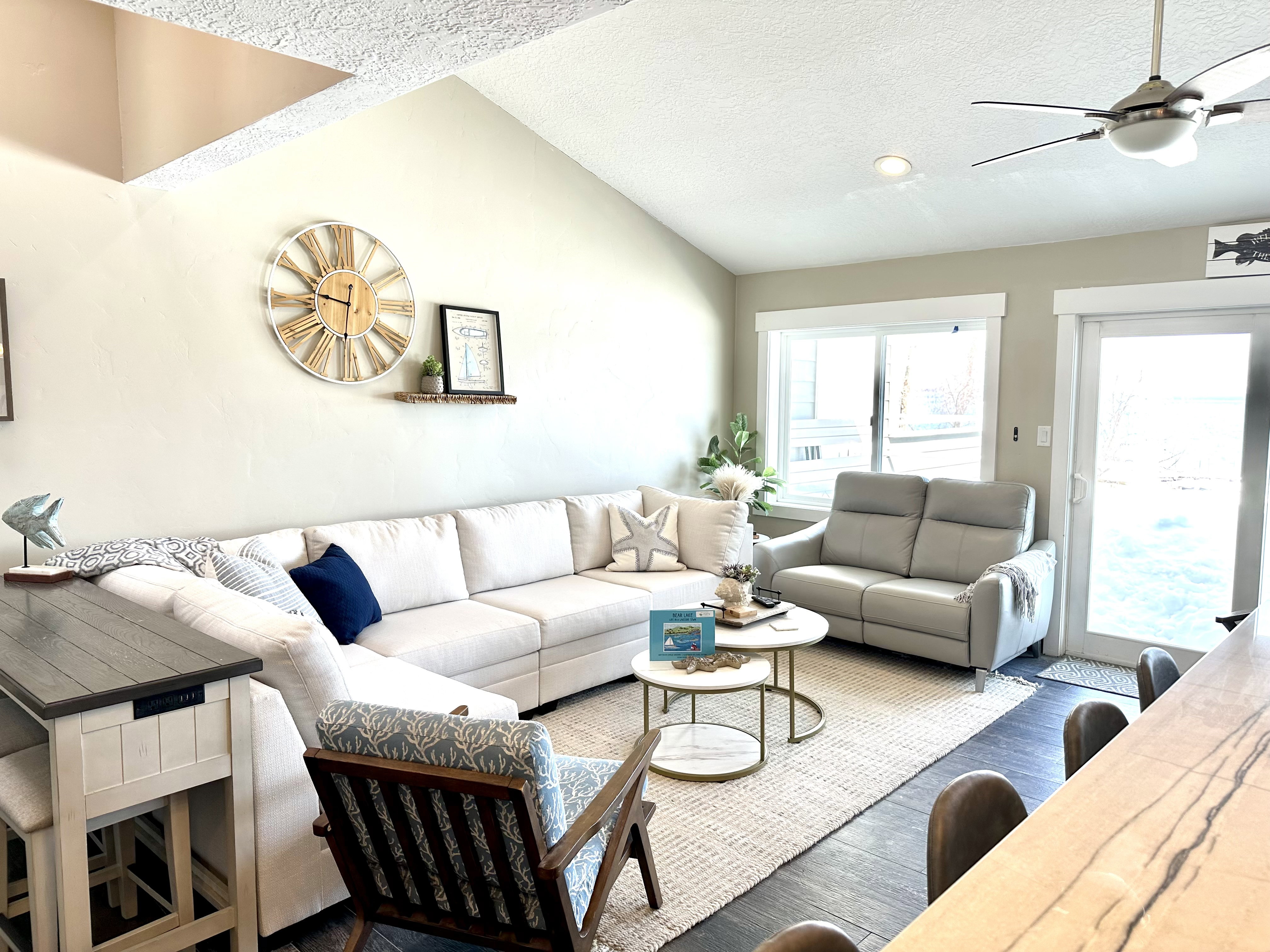Vaulted ceilings with recessed lighting and a ceiling fan