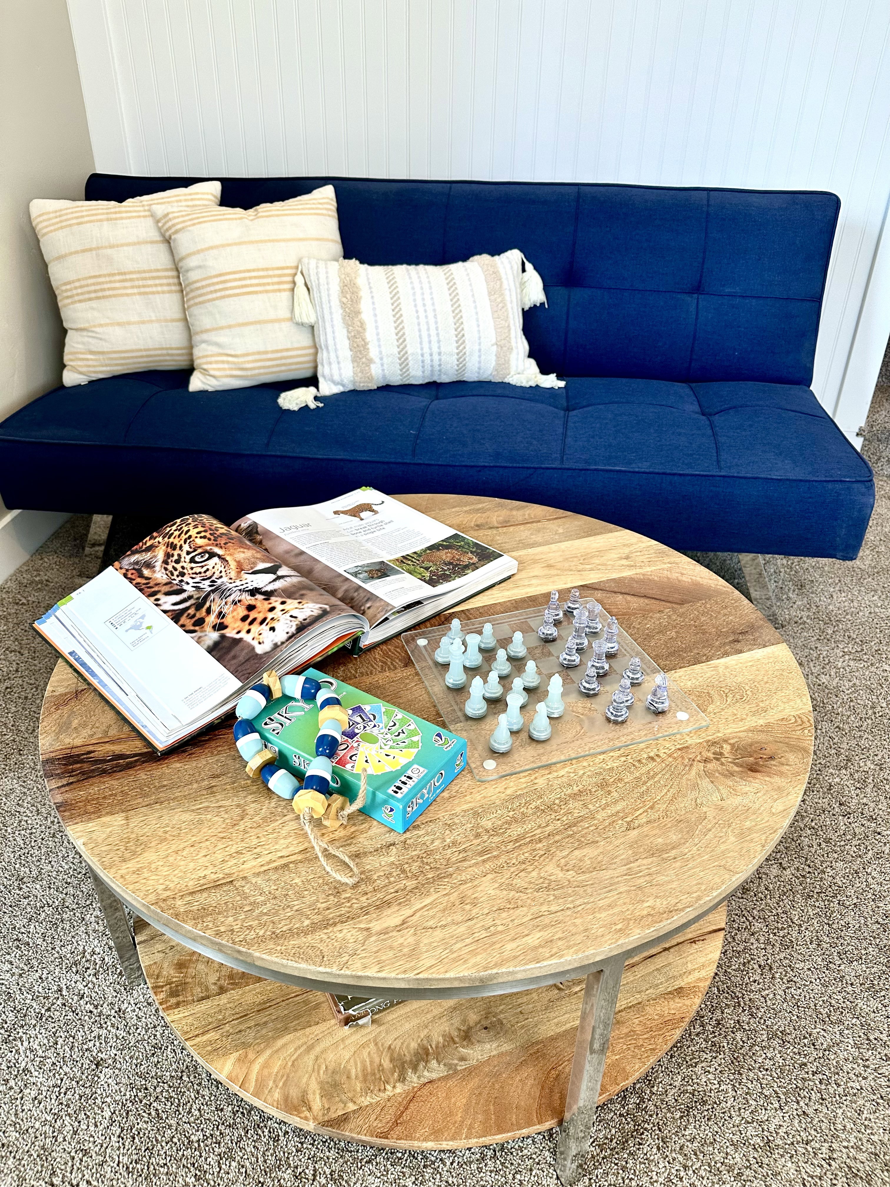 Warm wood-finish coffee table with a lower storage shelf