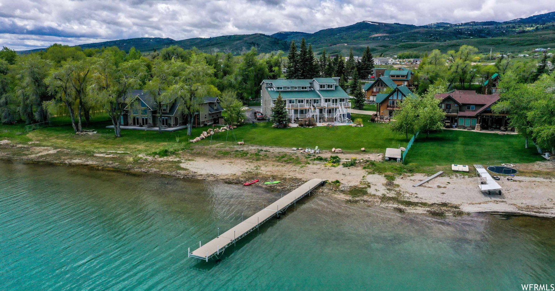 Waterfront property featuring a private dock and direct lake access