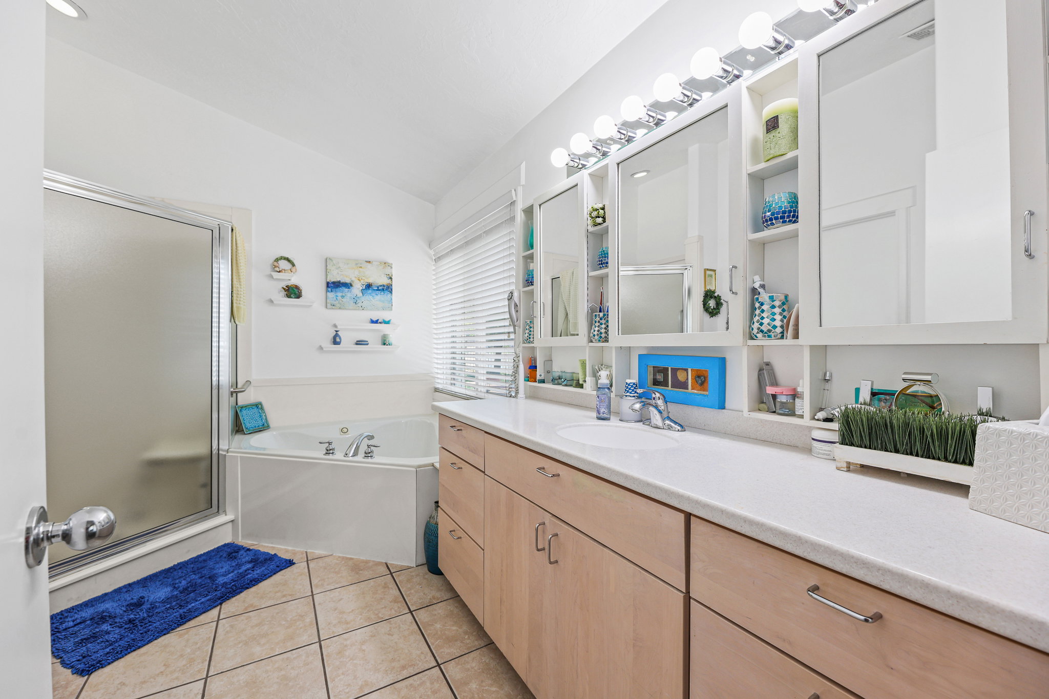 Dual vanity with integrated sinks and wood-finish cabinetry