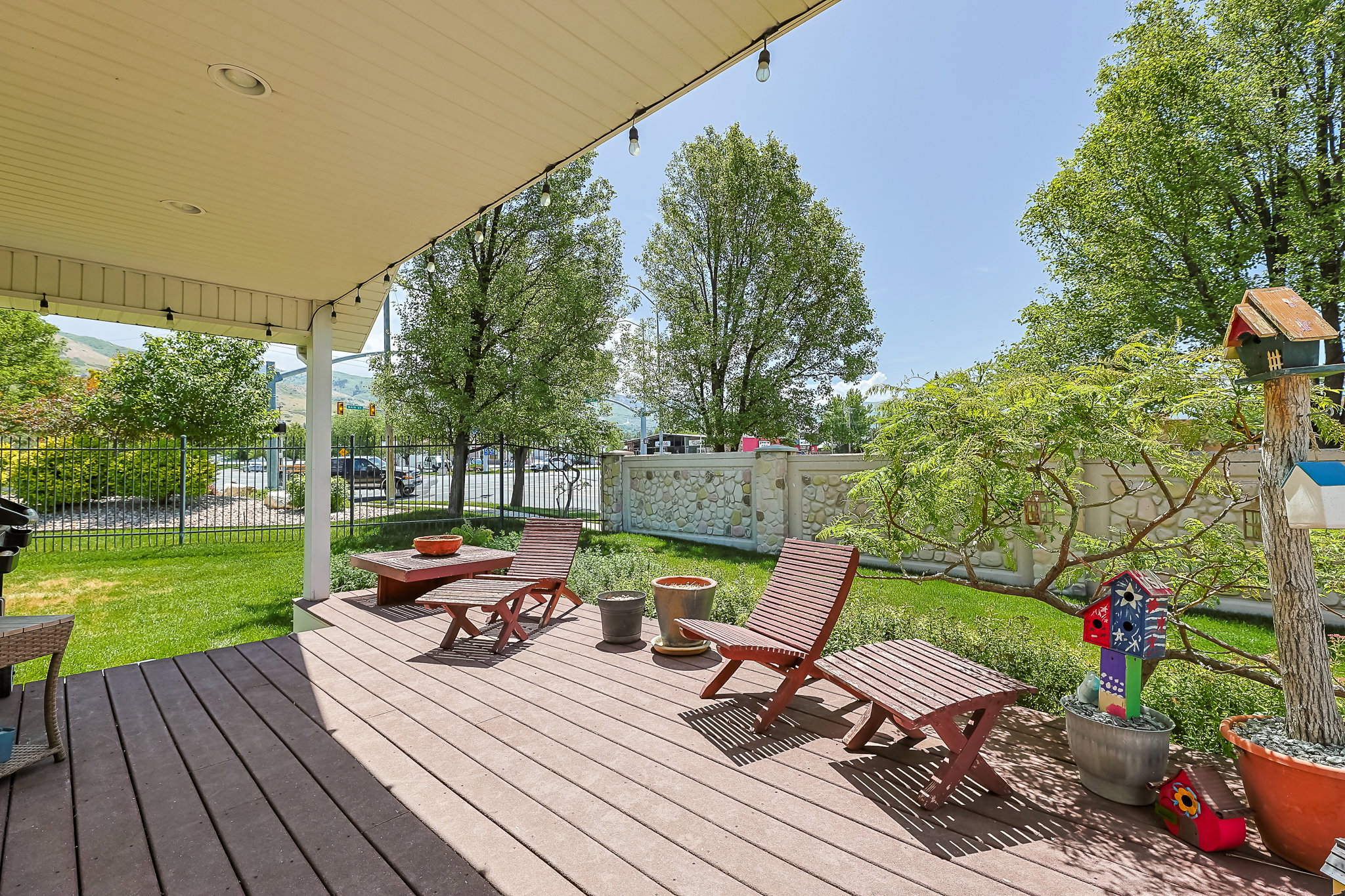 Spacious covered deck featuring composite wood-finish decking