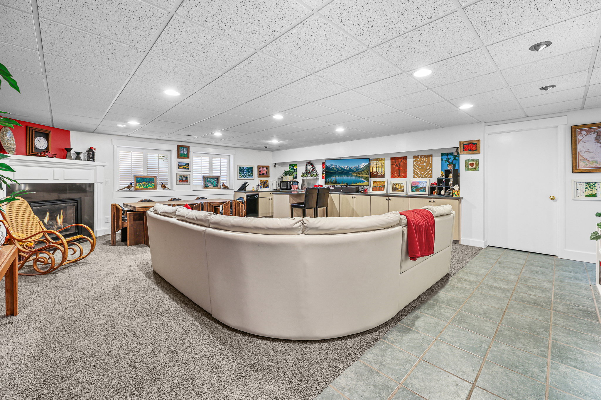 Open-plan lower level featuring recessed lighting and a drop ceiling