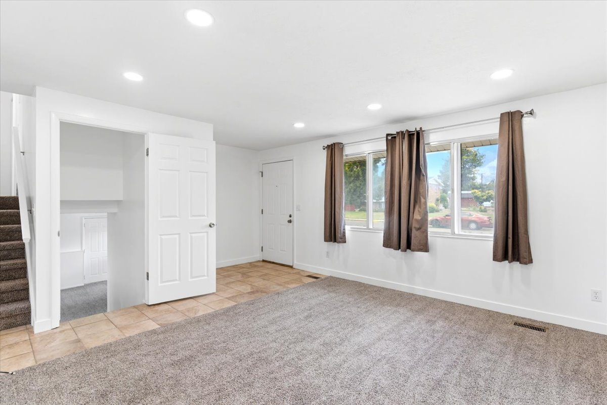 Bright interior space featuring recessed lighting and multiple windows