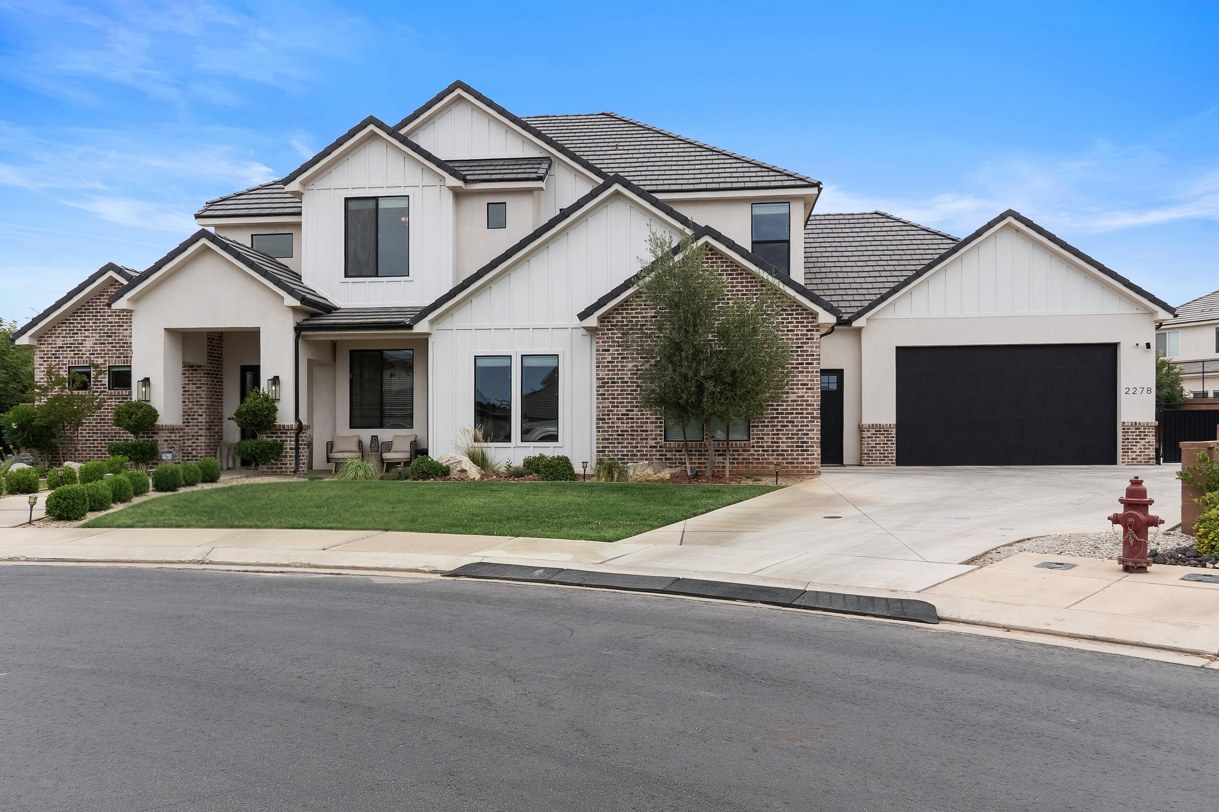 Contemporary architectural design featuring brick and stucco siding.