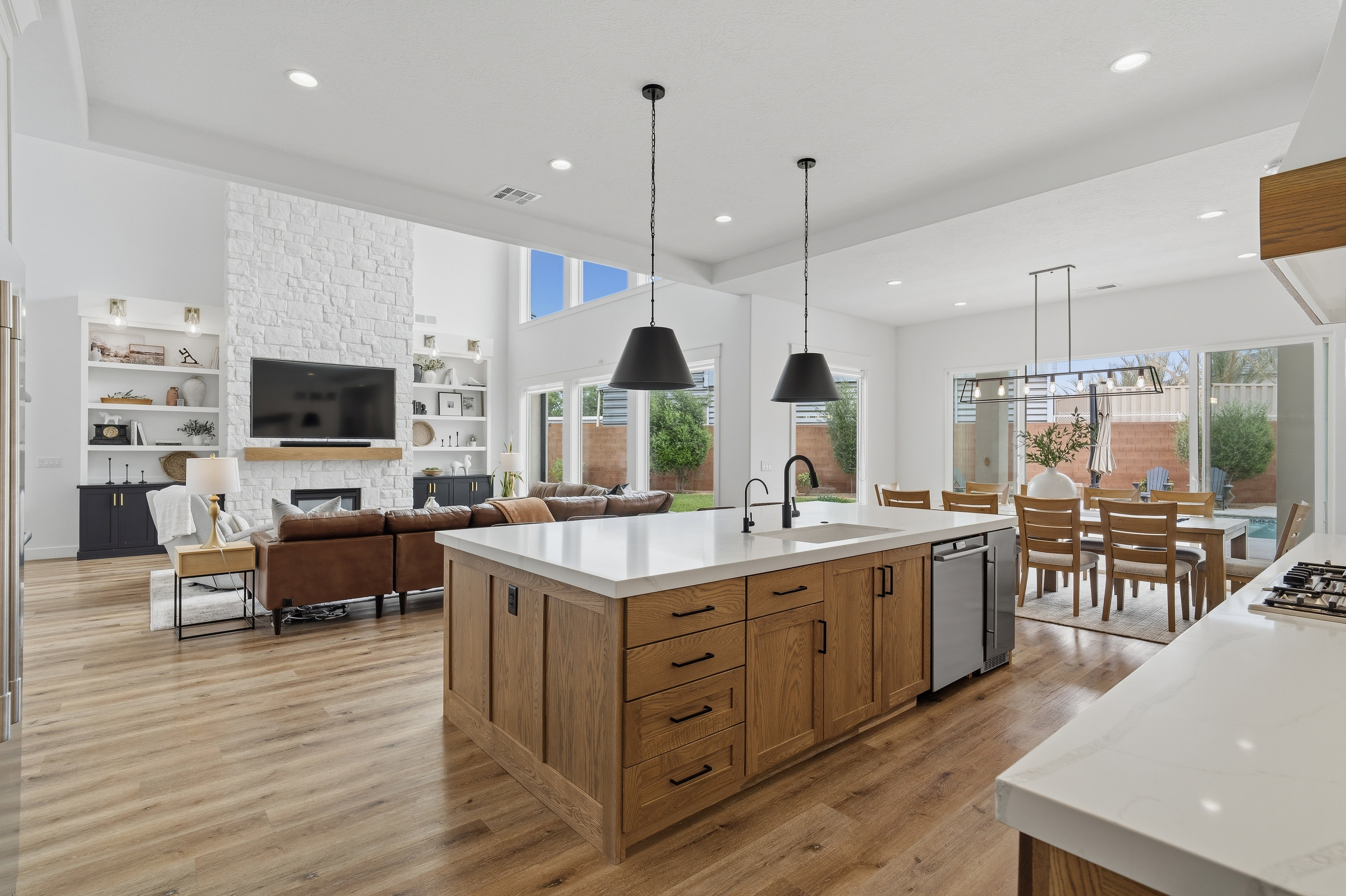 Open-concept interior featuring light wood-finish flooring throughout.