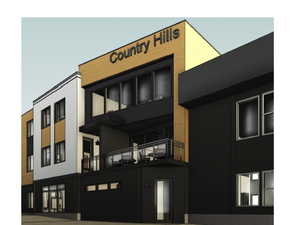 Modern multi-story building featuring varied facade materials including black siding, light-colored panels, and wood-toned accents