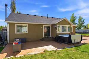 Expansive stamped concrete patio with direct access to the interior via a sliding glass door