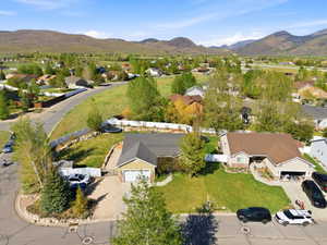 Ranch-style residence featuring a two-car garage and a paved driveway