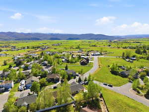 Expansive residential area featuring a mix of established homes and undeveloped green spaces