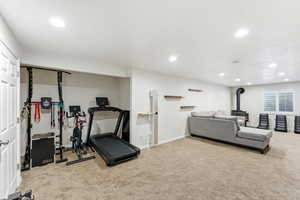 Spacious room featuring neutral carpeting and recessed lighting