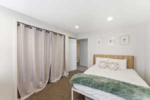 Bedroom featuring recessed lighting, a neutral color palette, and soft carpet flooring