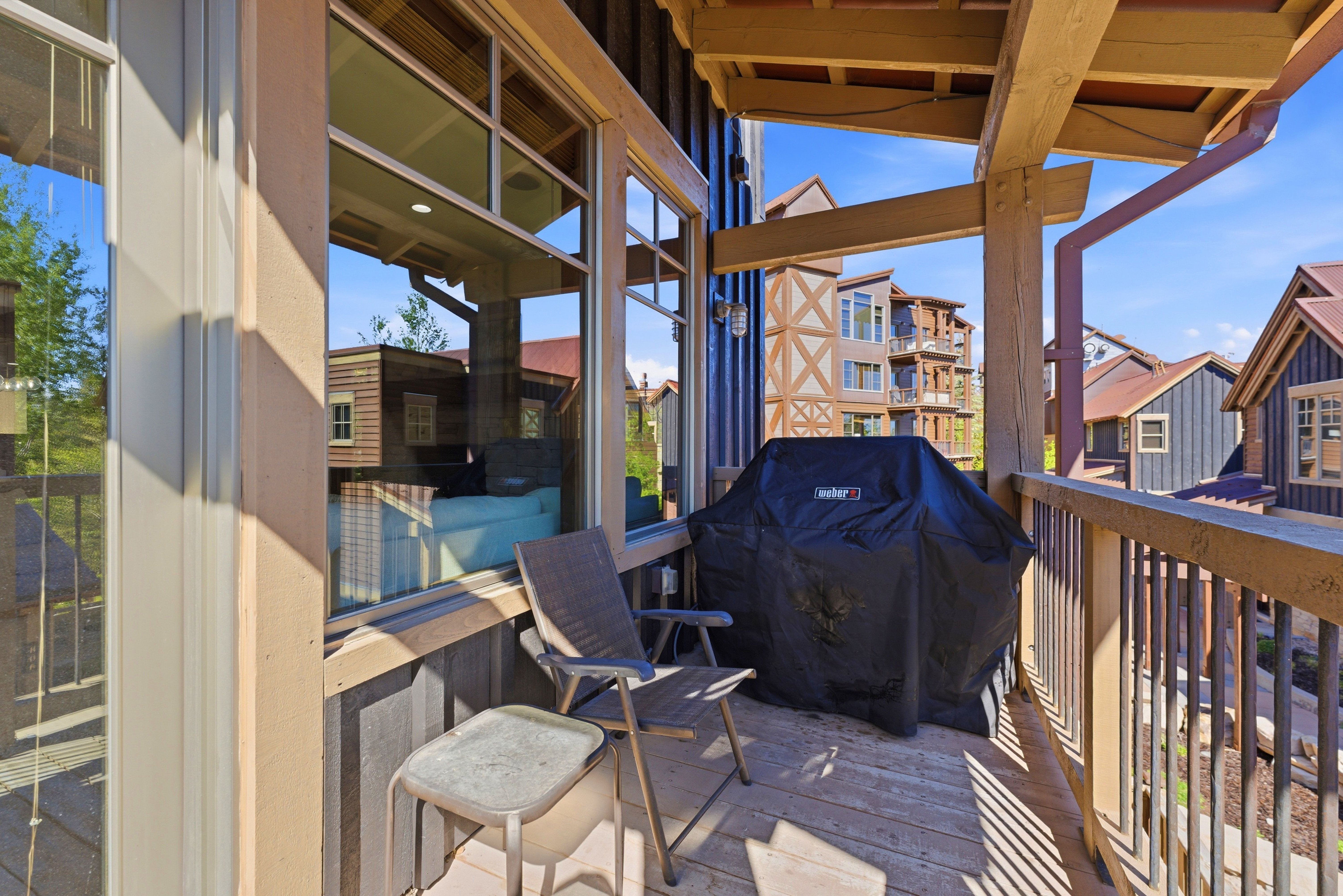Spacious outdoor balcony with wood decking and robust timber framing