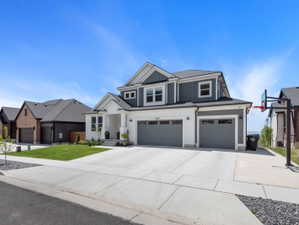 Modern two-story residence with a gray and white exterior