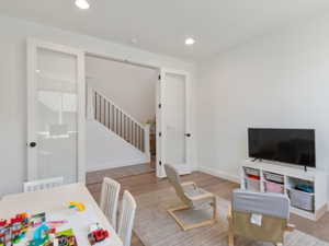 Interior room featuring wood-finish flooring and recessed lighting