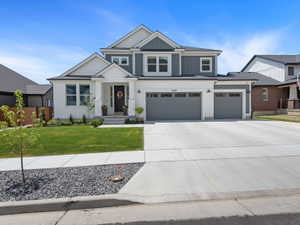 Contemporary two-story exterior featuring white brick and gray siding accents