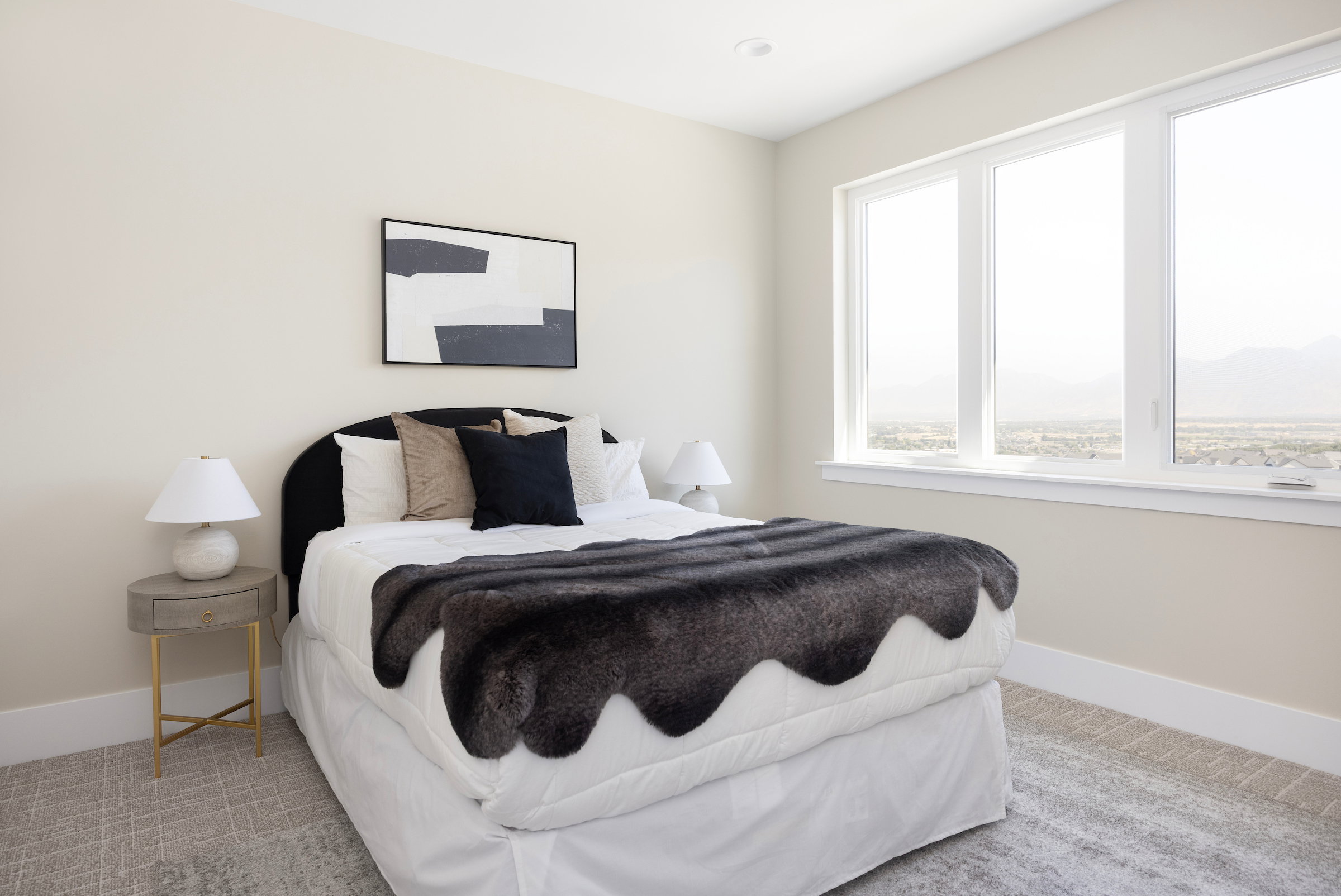 Bedroom featuring expansive windows, recessed lighting, neutral wall tones, and patterned carpeting