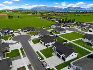 New construction homes featuring contemporary architectural design and manicured lawns