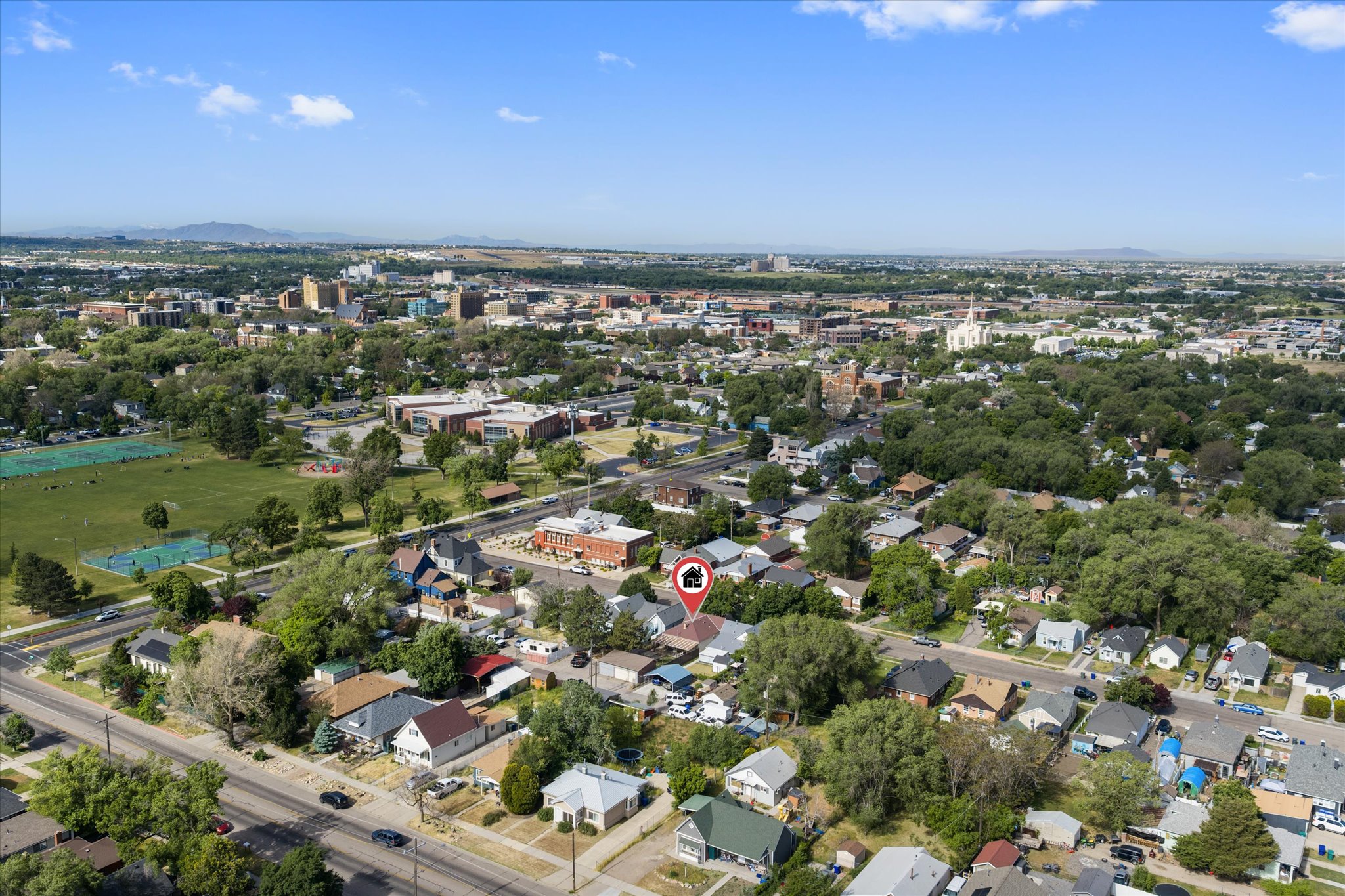 Aerial perspective showcasing a residential neighborhood with tree-lined streets