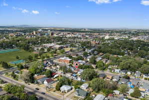 Aerial perspective showcasing a residential neighborhood with tree-lined streets