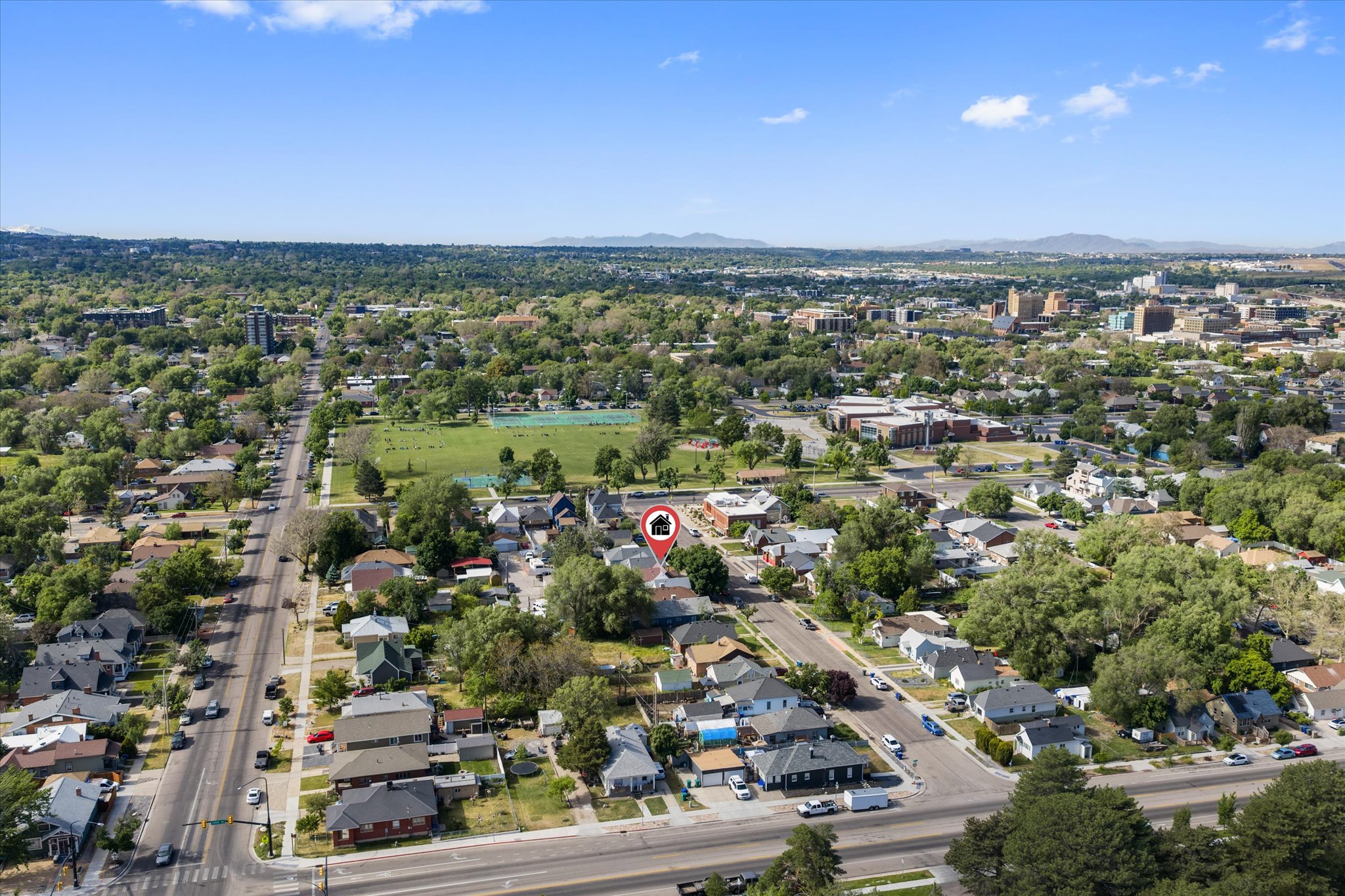 Aerial perspective showcasing the property within a neighborhood of established homes