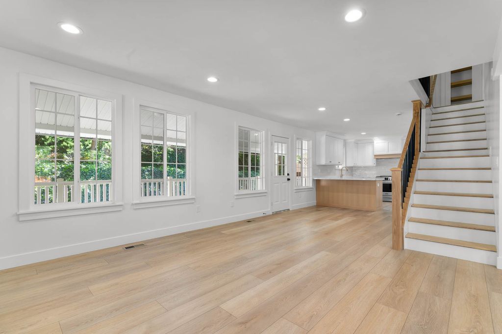 Open concept living space featuring light wood-finish flooring