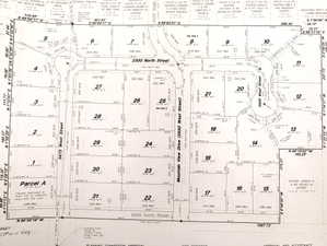 Plat Map. Illustrating the division of land into numbered parcels, including dimensions and street names