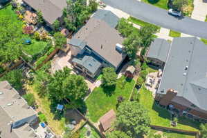 Expansive property featuring a multi-level roofline, skylights, and a detached structure