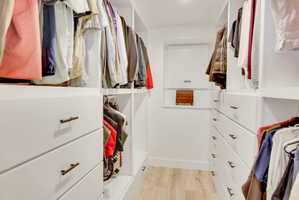 Custom closet system featuring ample storage