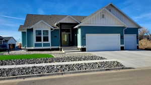 Modern ranch-style exterior with teal siding and white trim