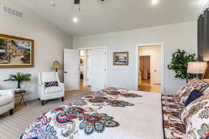 Vaulted ceiling with recessed lighting and a ceiling fan