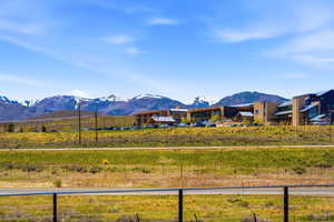 Modern architectural complex featuring a stone and wood exterior with multiple gables