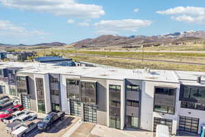 Modern multi-level townhome-style residences featuring a contemporary facade with varying paneling and large windows