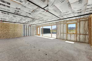Spacious interior with exposed wood framing and ceiling insulation