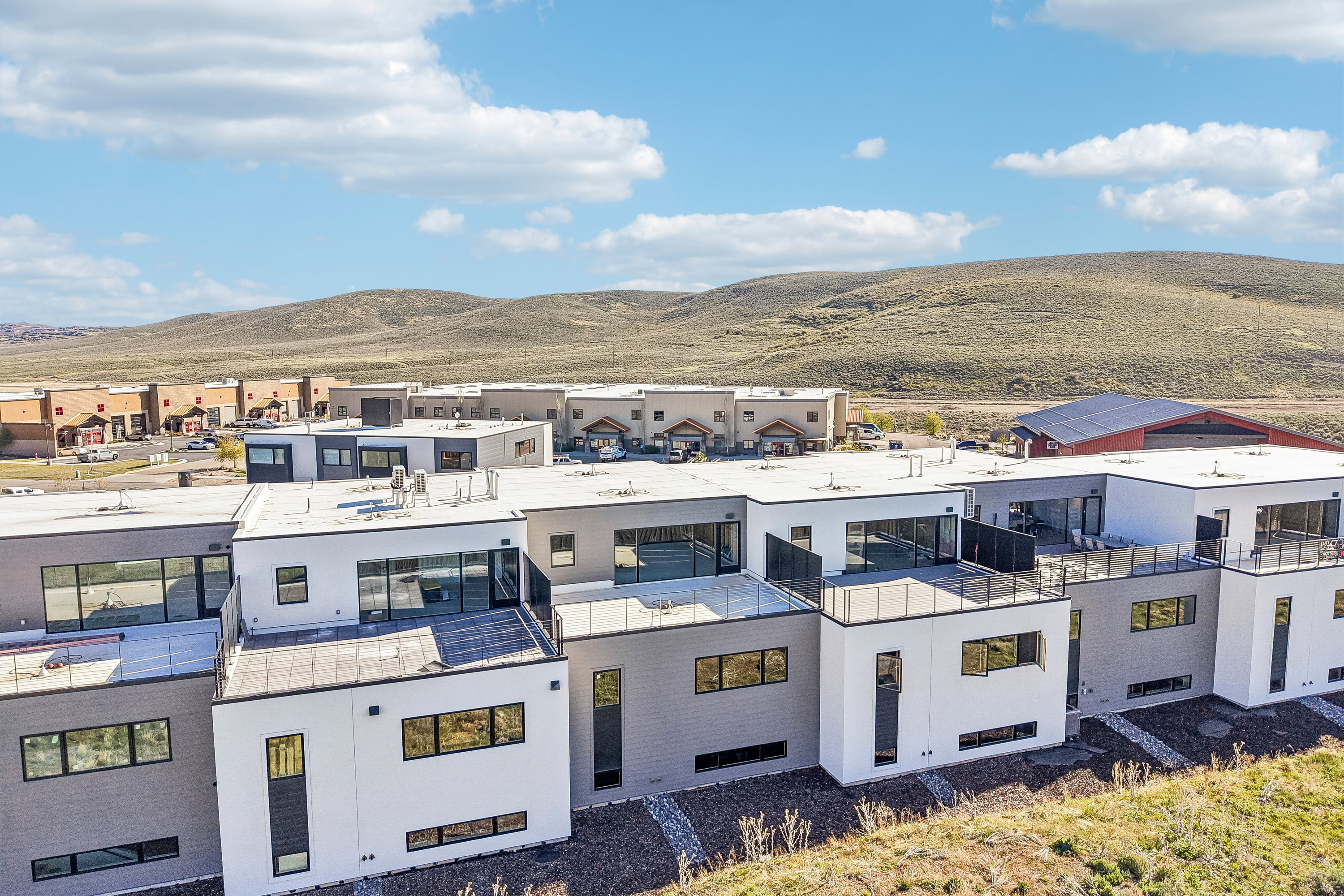 Modern residential architecture featuring a flat roofline and multi-toned facade