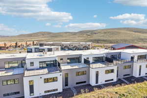 Modern residential architecture featuring a flat roofline and multi-toned facade