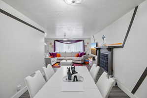 Dining area with wood-finish flooring