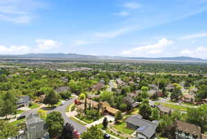 Expansive neighborhood showcasing numerous residences amidst abundant mature trees