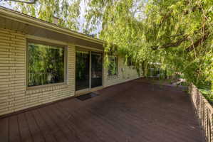 Expansive wood deck with a metal railing