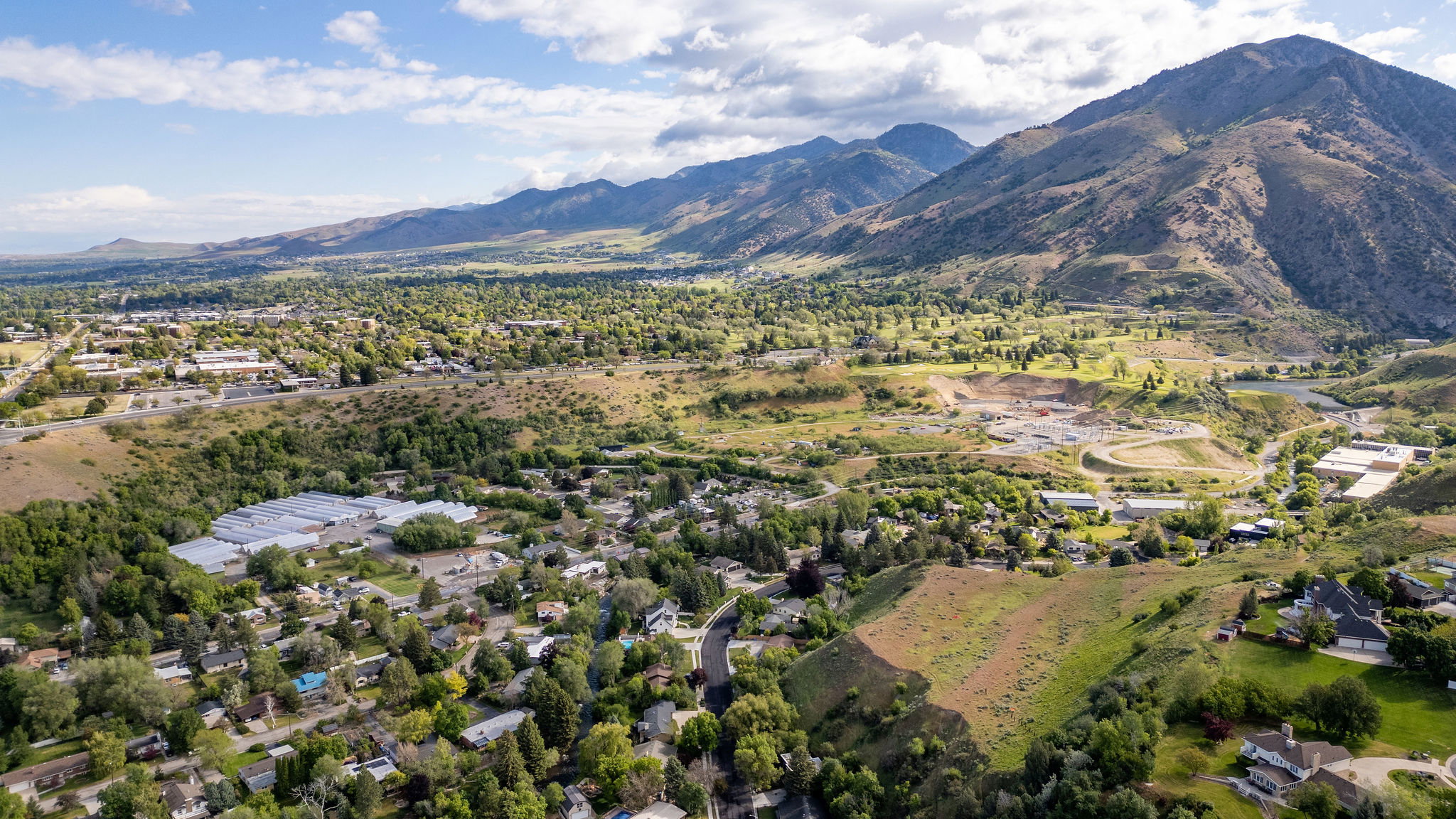 Expansive mountainous backdrop framing a verdant landscape