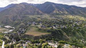 Expansive mountain range backdrop with visible snow caps