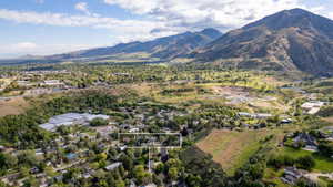 Expansive aerial perspective showcasing the property within a mountainous landscape
