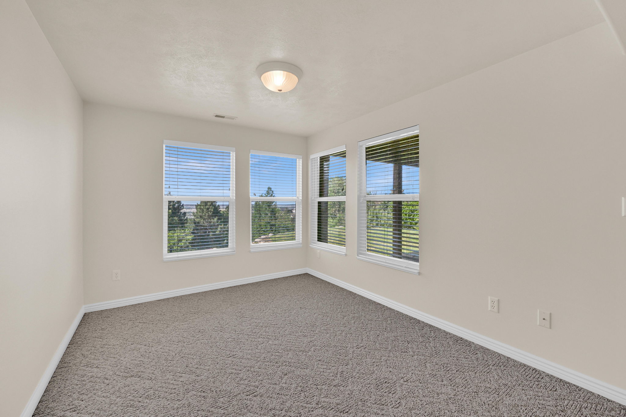Neutral wall paint complemented by white trim