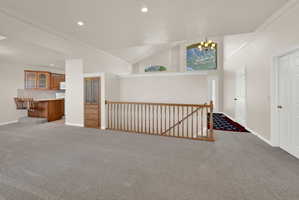 Expansive interior featuring vaulted ceilings and recessed lighting
